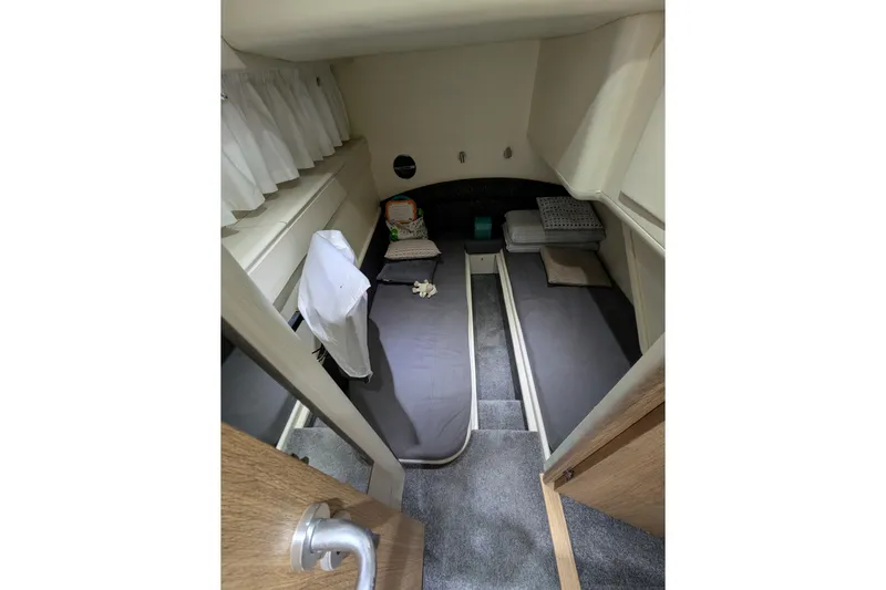  Yacht Photos Pics 1998 Princess 52 Flybridge Motor Yacht cabin with twin beds and cozy decor.