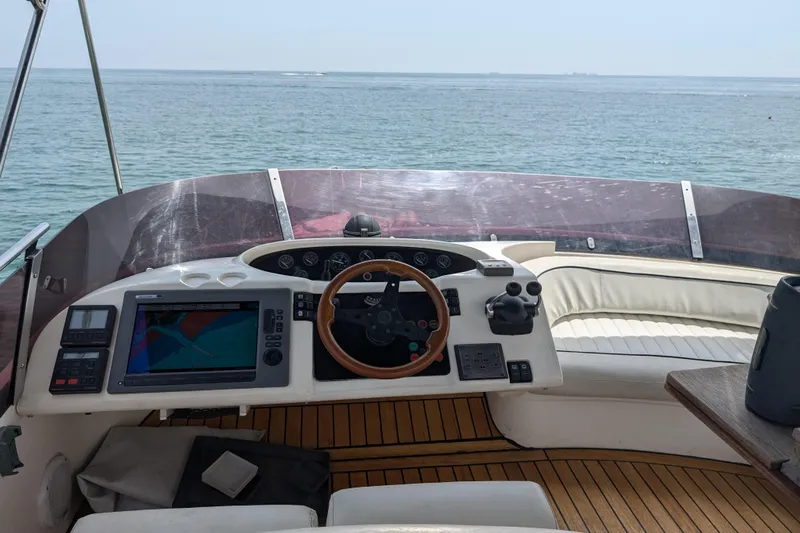  Yacht Photos Pics Flybridge helm of 1998 Princess 52 Motor Yacht with ocean view.