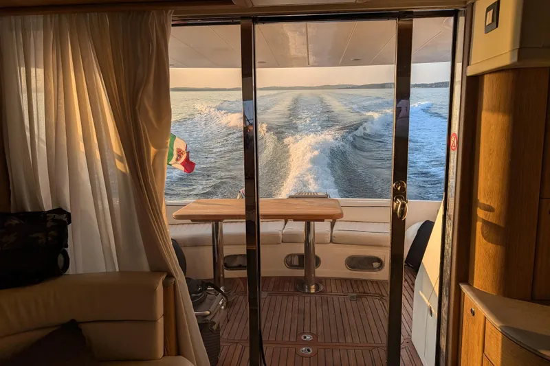  Yacht Photos Pics Interior view of 1998 Princess 52 Flybridge Motor Yacht, showcasing elegant design and ocean view.