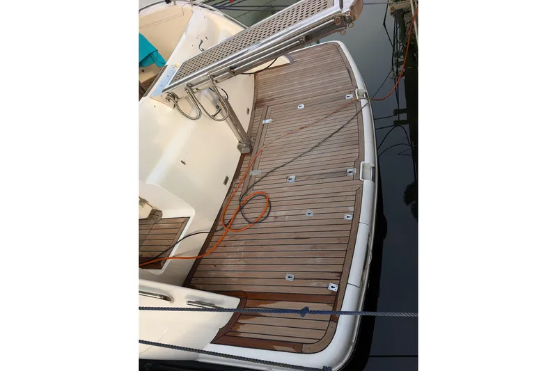  Yacht Photos Pics 1998 Princess 52 Flybridge Motor Yacht teak deck with swim platform and ladder.