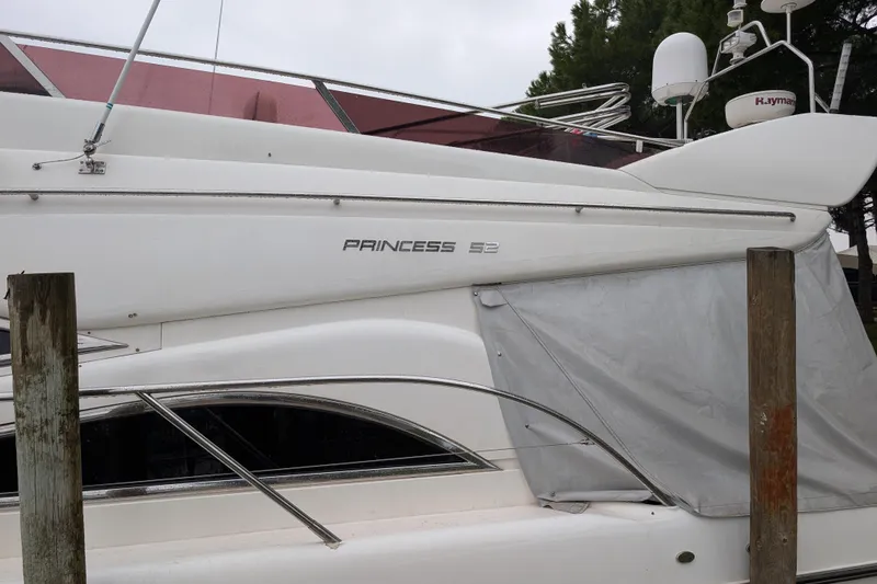  Yacht Photos Pics 1998 Princess 52 Flybridge Motor Yacht docked, featuring sleek design and modern equipment.