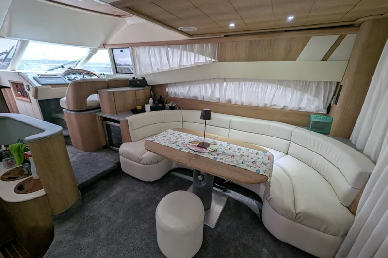  Yacht Photos Pics Luxurious interior of a 1998 Princess 52 Flybridge Motor Yacht with elegant seating and decor.