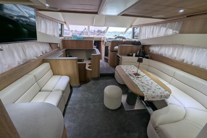  Yacht Photos Pics Luxurious interior of a 1998 Princess 52 Flybridge Motor Yacht with elegant seating and decor.