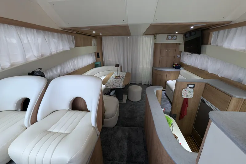  Yacht Photos Pics Luxurious interior of a 1998 Princess 52 Flybridge Motor Yacht with elegant seating and modern amenities.