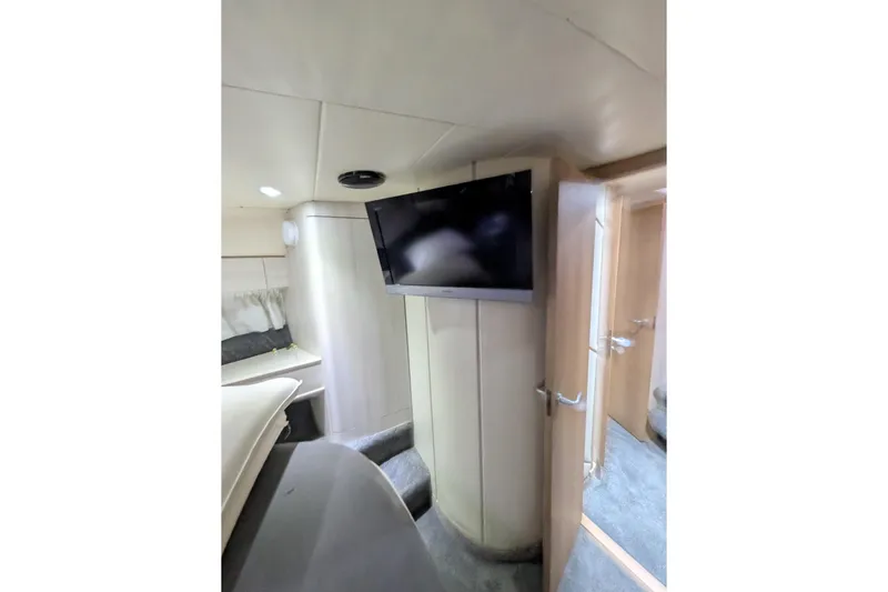  Yacht Photos Pics Interior of 1998 Princess 52 Flybridge Motor Yacht with TV and cozy cabin.