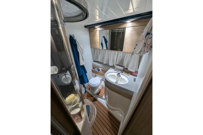  Yacht Photos Pics Bathroom interior of 1998 Princess 52 Flybridge Motor Yacht, featuring sink and toilet.