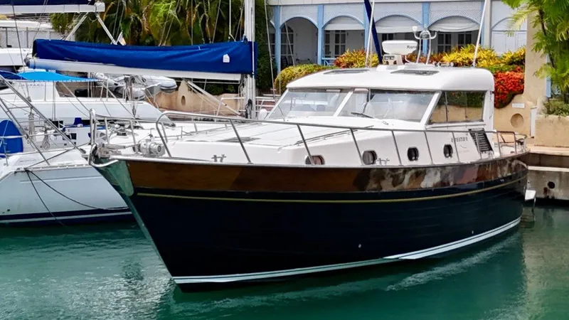  Yacht Photos Pics 2001 Apreamare 12m yacht docked in a marina, surrounded by other boats.