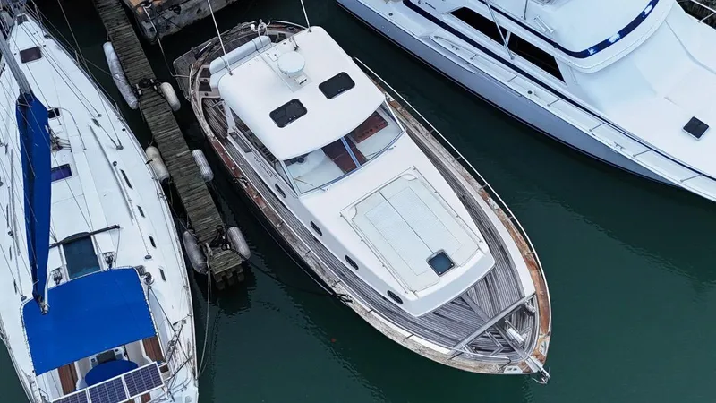  Yacht Photos Pics Aerial view of a 2001 Apreamare 12m yacht docked between boats.
