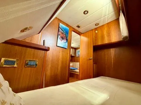  Yacht Photos Pics Interior of 2001 Apreamare 12m yacht, featuring cozy wooden cabin and modern amenities.