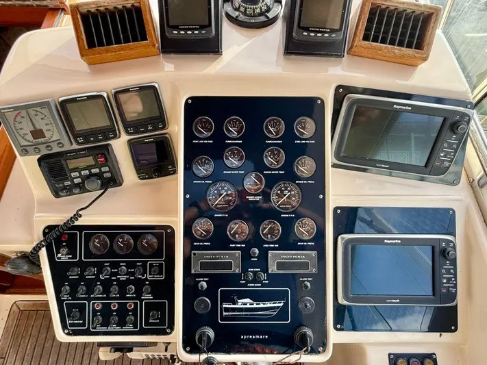  Yacht Photos Pics Control panel of a 2001 Apreamare 12m boat with various gauges and navigation equipment.