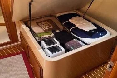 Petrel Yacht Photos Pics Storage compartment under forward berth.