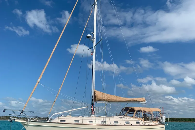 Petrel Yacht Photos Pics 2001 Island Packet 420 sailboat on turquoise water under blue sky.
