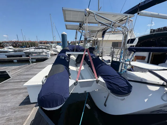 Ventosa Yacht Photos Pics Catalina 350 sailboat docked, featuring solar panels and covered equipment, 2006 model.