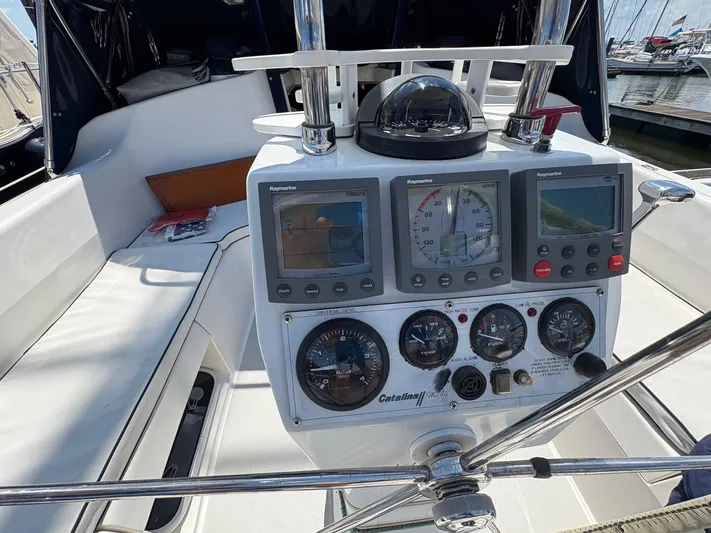 Ventosa Yacht Photos Pics Cockpit of 2006 Catalina 350 sailboat with navigation instruments and compass.