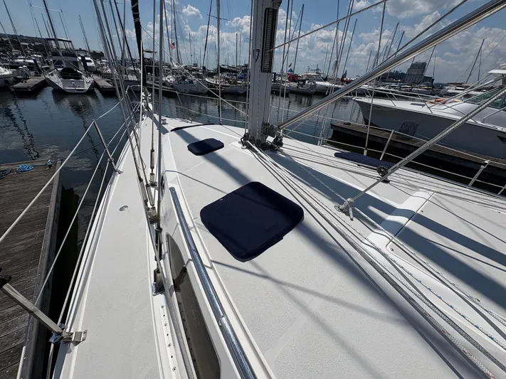 Ventosa Yacht Photos Pics 2006 Catalina 350 sailboat docked at marina, surrounded by other boats under a partly cloudy sky.