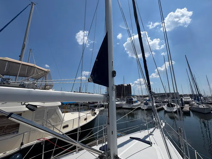 Ventosa Yacht Photos Pics Sailboats docked at a marina under a clear blue sky, featuring a 2006 Catalina 350.
