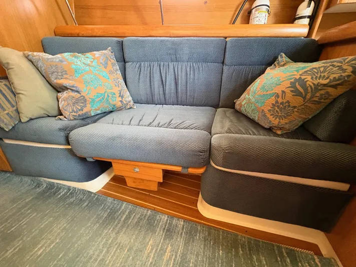 Ventosa Yacht Photos Pics Cozy seating area in a 2006 Catalina 350 sailboat with decorative cushions.
