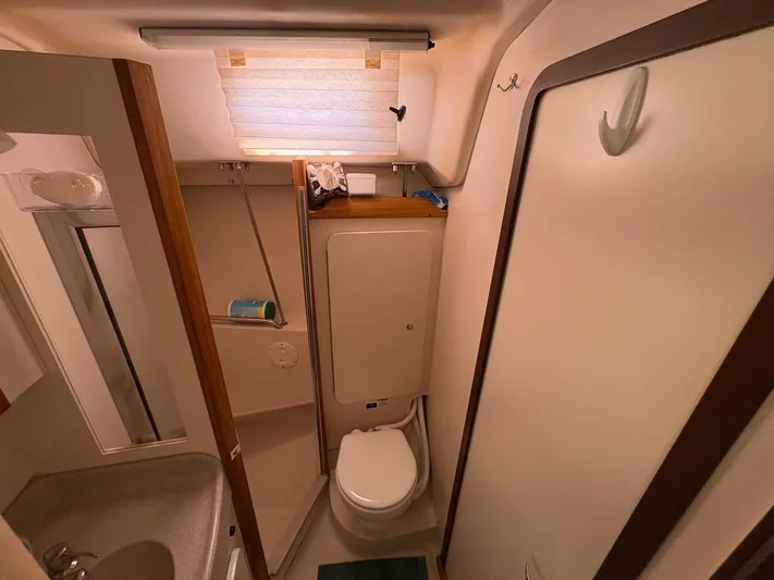 Ventosa Yacht Photos Pics Bathroom interior of a 2006 Catalina 350 sailboat, featuring a compact design.