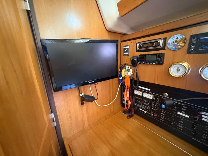 Ventosa Yacht Photos Pics Interior of a 2006 Catalina 350 yacht with navigation equipment and mounted TV.