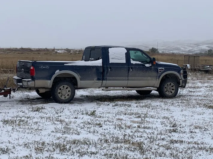 Mv Belle Yacht Photos Pics Blue pickup truck in snowy field, Custom Tour Boat and Business, 1987 model.