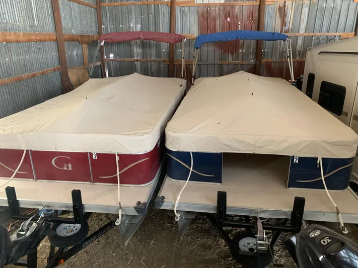 Mv Belle Yacht Photos Pics Two covered 1987 Custom tour boats stored in a metal shed.