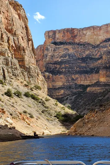 Mv Belle Yacht Photos Pics Tour boat navigating through scenic canyon with towering cliffs, 1987.