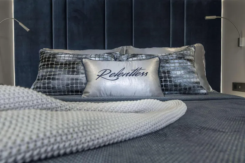 Relentless Yacht Photos Pics Luxurious Sunreef Sail 60 yacht bedroom with elegant pillows and modern design, 2020 model.