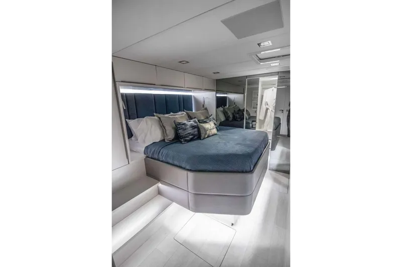 Relentless Yacht Photos Pics Luxurious bedroom interior of 2020 Sunreef Sail 60 yacht with modern design and plush bedding.