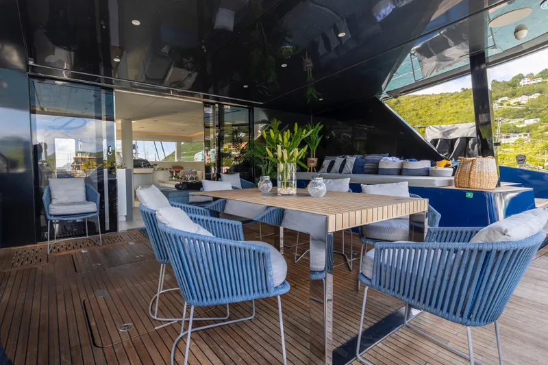 Relentless Yacht Photos Pics Luxurious Sunreef Sail 60 yacht deck with elegant dining area, 2020 model.