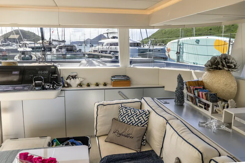 Relentless Yacht Photos Pics Luxurious interior of 2020 Sunreef Sail 60 yacht with marina view.