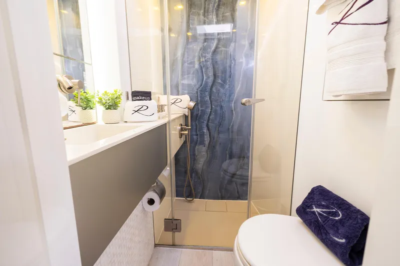 Relentless Yacht Photos Pics Luxurious bathroom in 2020 Sunreef Sail 60 yacht with modern shower and elegant decor.