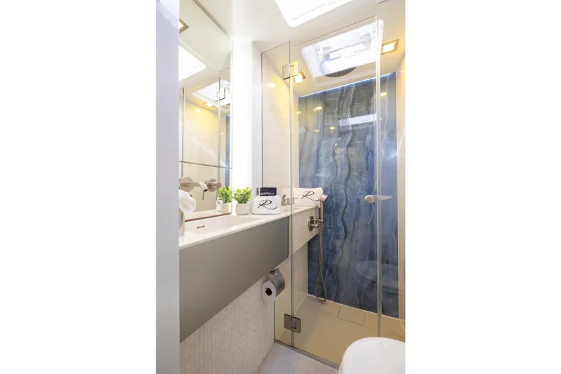 Relentless Yacht Photos Pics Luxurious bathroom in 2020 Sunreef Sail 60 yacht with modern fixtures and elegant design.