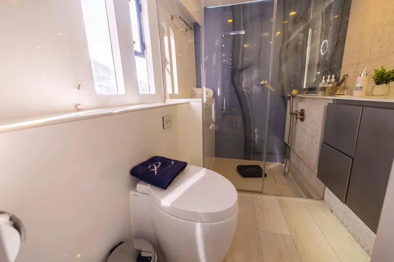 Relentless Yacht Photos Pics Luxurious bathroom in 2020 Sunreef Sail 60 yacht with modern shower and elegant fixtures.