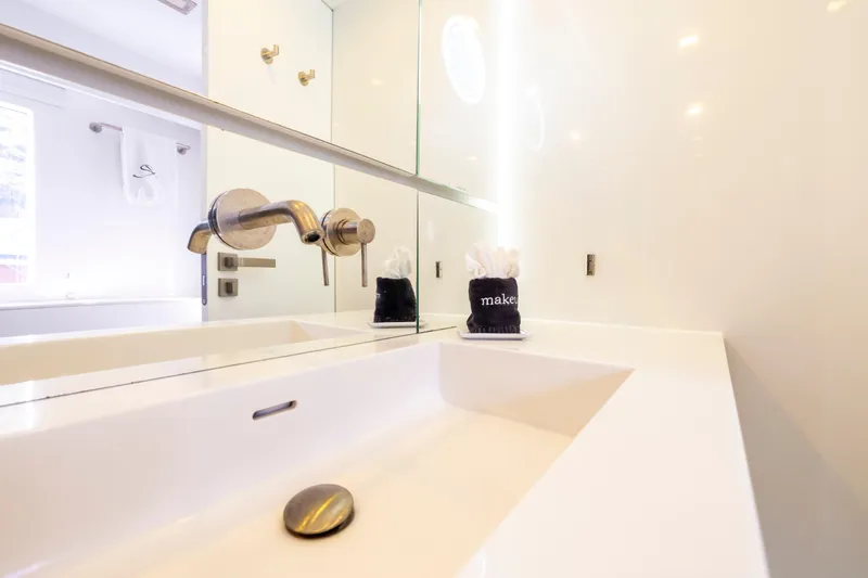 Relentless Yacht Photos Pics Modern bathroom sink on 2020 Sunreef Sail 60 yacht, featuring sleek fixtures and elegant design.