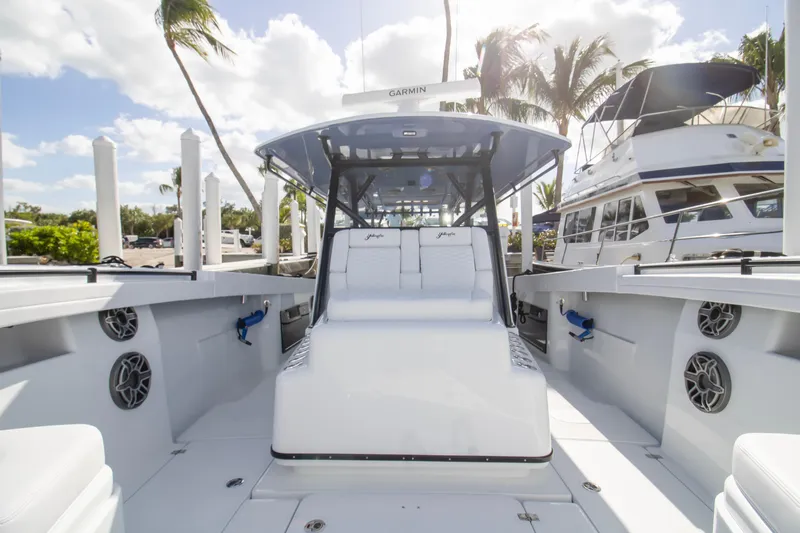  Yacht Photos Pics 2026 Yellowfin 42 Offshore boat with sleek design, docked under sunny skies.