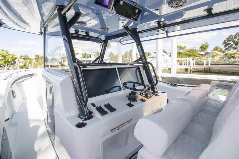  Yacht Photos Pics 2026 Yellowfin 42 Offshore boat interior with modern helm and seating.