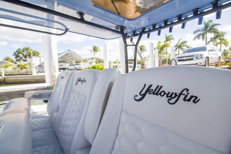  Yacht Photos Pics 2026 Yellowfin 42 Offshore boat interior with branded seating, dockside view.