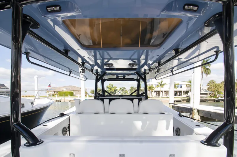  Yacht Photos Pics Interior view of 2026 Yellowfin 42 Offshore boat, showcasing seating and sleek design.