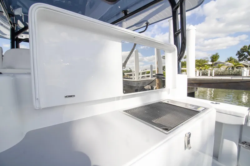  Yacht Photos Pics 2026 Yellowfin 42 Offshore boat with sleek white interior and outdoor grill station.