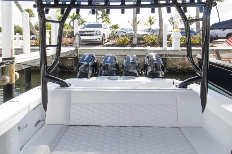  Yacht Photos Pics 2026 Yellowfin 42 Offshore boat with triple outboard engines at a marina.