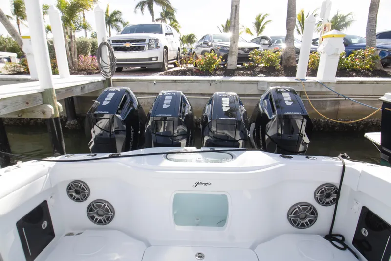  Yacht Photos Pics 2026 Yellowfin 42 Offshore boat with four powerful Mercury outboard engines docked.