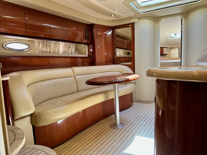 Alibi Yacht Photos Pics Luxurious interior of 2004 Sea Ray 420 Sundancer yacht with elegant wood finishes.
