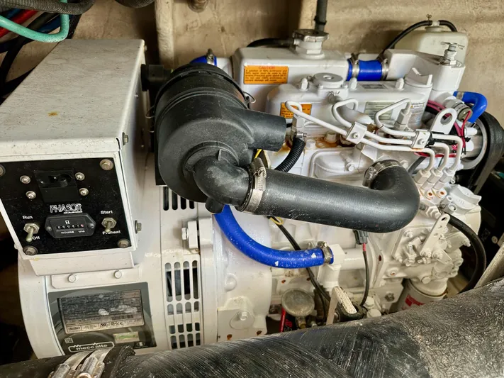 Alibi Yacht Photos Pics Engine compartment of a 2004 Sea Ray 420 Sundancer boat, featuring mechanical components.