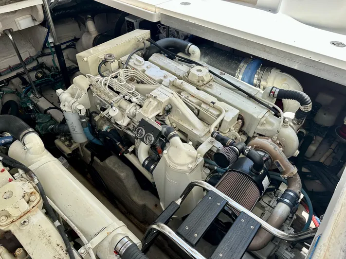 Alibi Yacht Photos Pics Engine compartment of a 2004 Sea Ray 420 Sundancer boat, showcasing mechanical components.