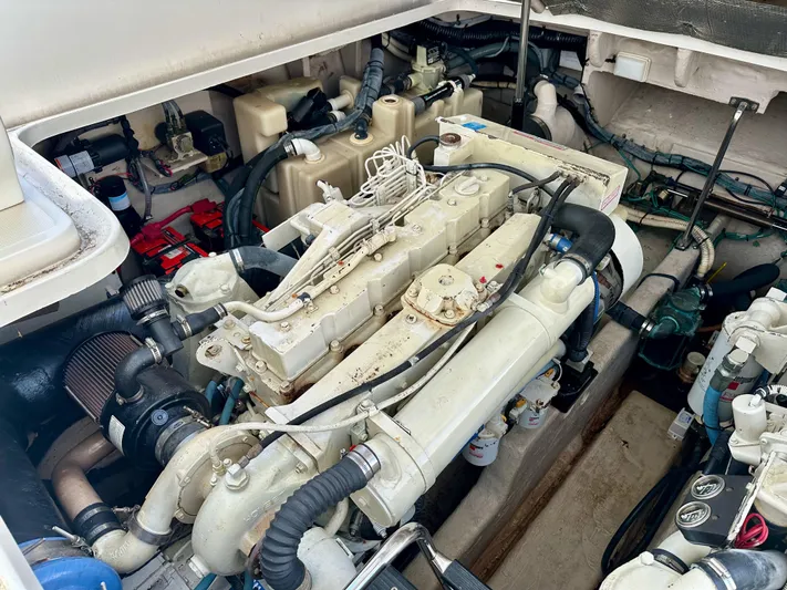 Alibi Yacht Photos Pics Engine compartment of a 2004 Sea Ray 420 Sundancer boat, showcasing mechanical components.