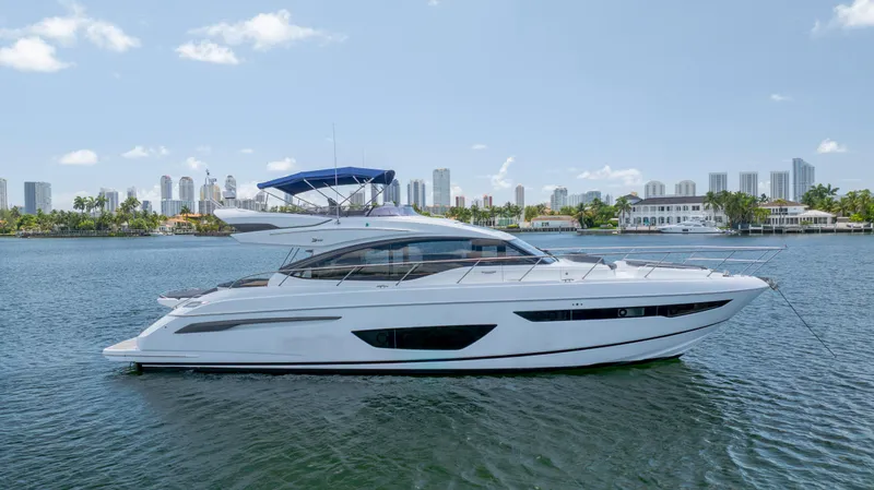  Yacht Photos Pics 2017 Princess S65 yacht on water with city skyline in background.