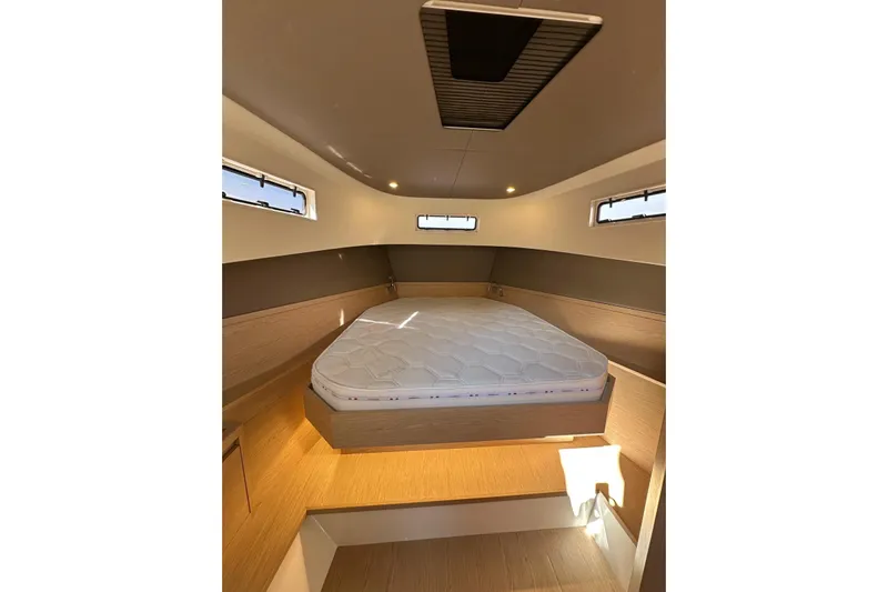  Yacht Photos Pics Luxurious cabin interior of 2024 Solaris Power 40 Open yacht with cozy bed and modern design.