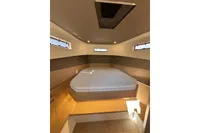 Luxurious cabin interior of 2024 Solaris Power 40 Open yacht with cozy bed and modern design.