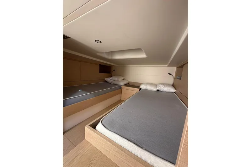  Yacht Photos Pics 2024 Solaris Power 40 Open cabin with twin beds and modern interior design.