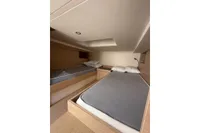 2024 Solaris Power 40 Open cabin with twin beds and modern interior design.